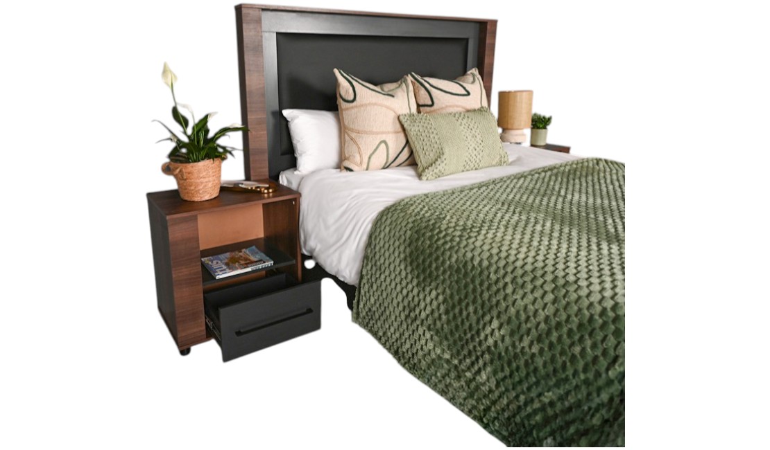 A black PU leather padded Madison headboard and pedestals set, and a bed with green and white bedding, against a white background