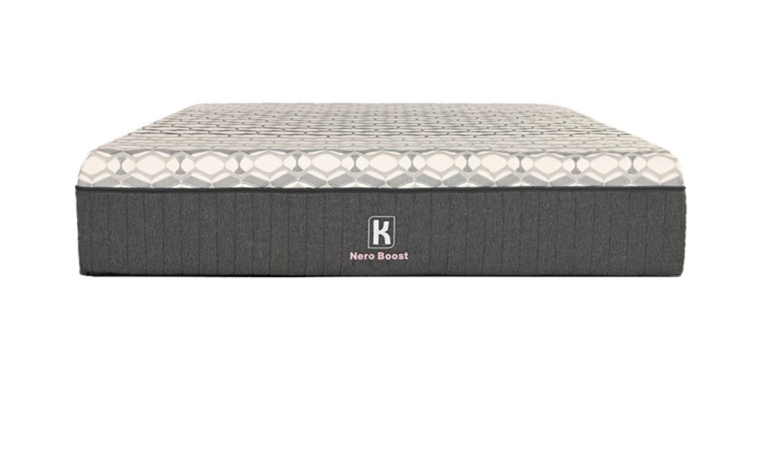 Grey Kooi mattress with a patterned top against a white background.