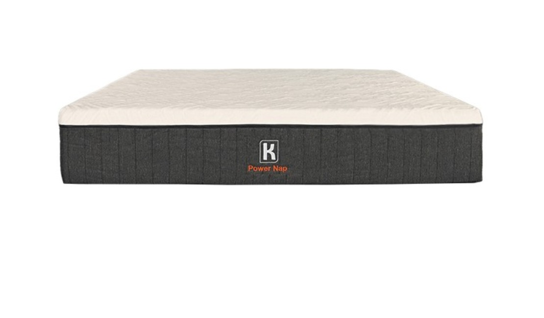 A dark grey and white Kooi mattress against a white background