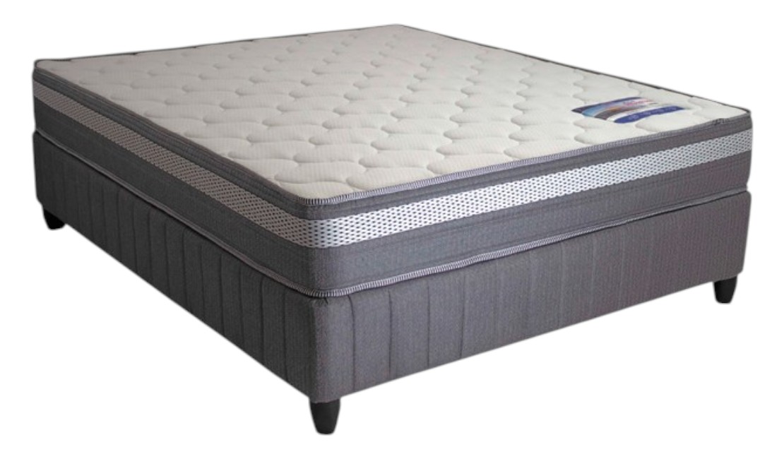 Grey and white Rest Assured hospitality bed against a white background