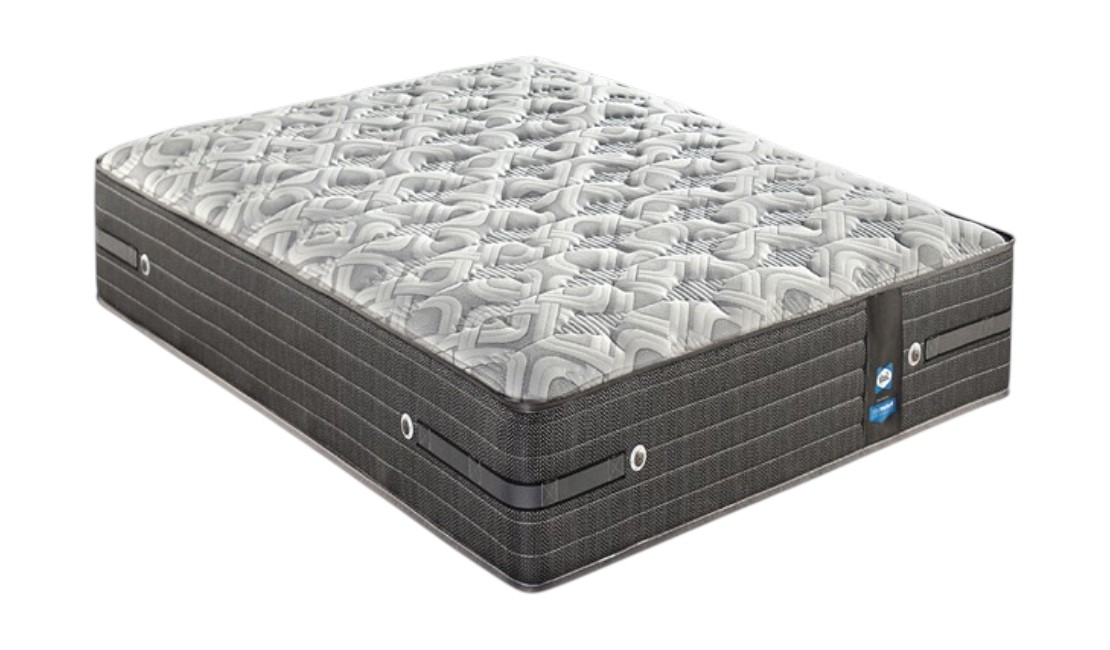 Grey firm mattress against a white background